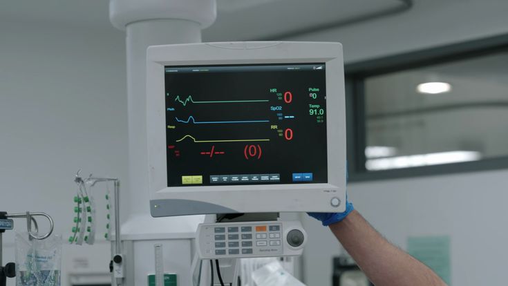 Doctor reviewing real-time patient vitals